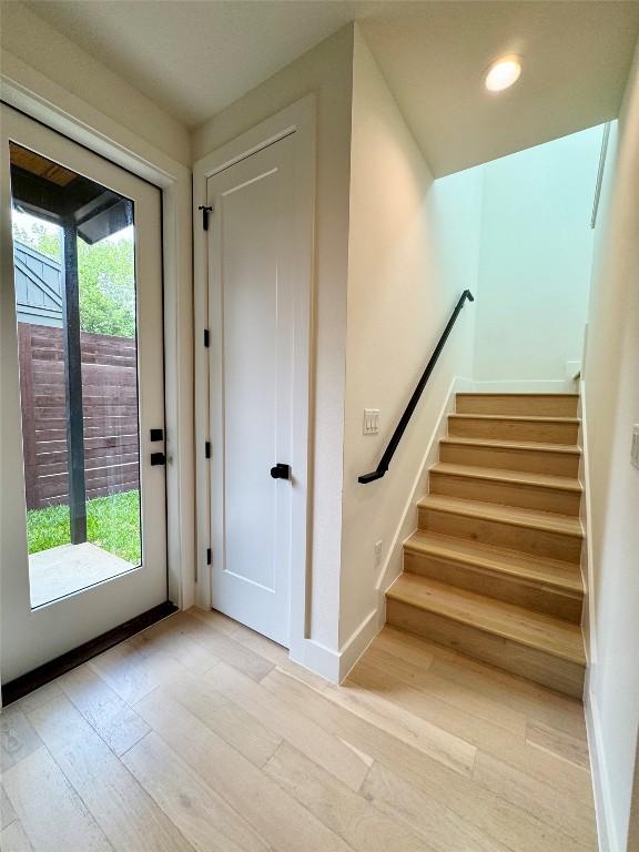 1708 Canterbury St Unit 2, Austin, TX 78702 - stairway with hardwood / wood-style flooring, baseboards, and recessed lighting