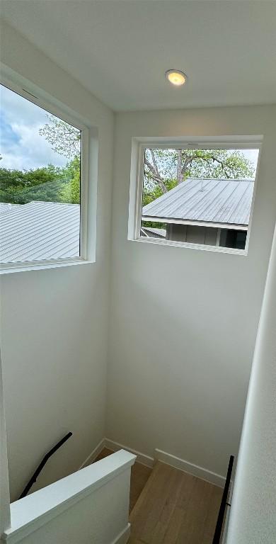 1708 Canterbury St Unit 2, Austin, TX 78702 - detailed view of wood finished floors, baseboards, and recessed lighting