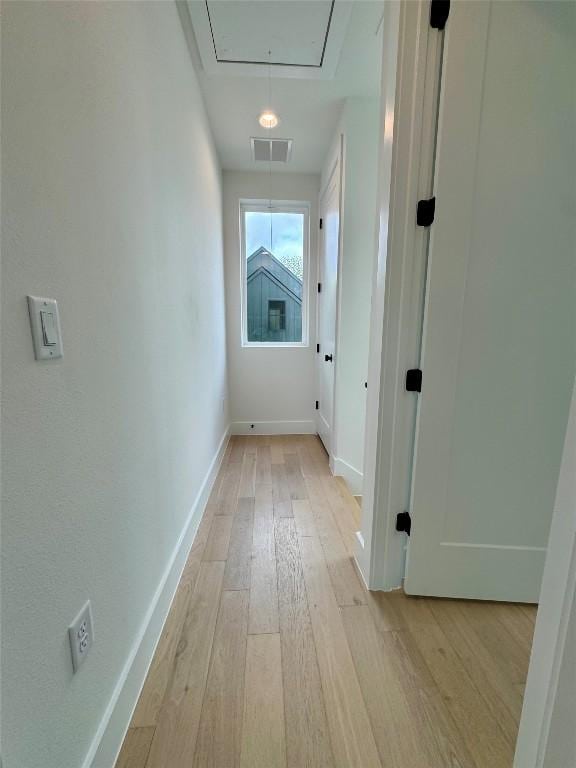 1708 Canterbury St Unit 2, Austin, TX 78702 - hall featuring attic access, light wood-type flooring, and baseboards