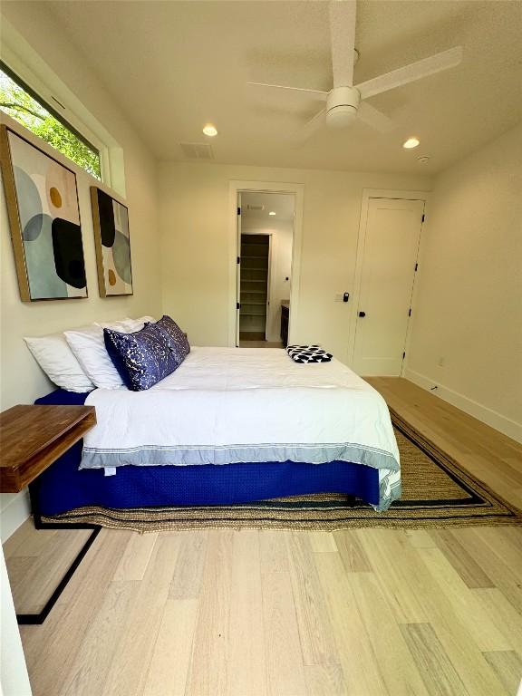 1708 Canterbury St Unit 2, Austin, TX 78702 - bedroom featuring wood finished floors, recessed lighting, baseboards, and a ceiling fan