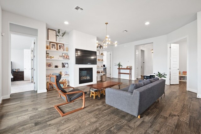 513 Elworth Path, Lakeway, TX 78738 - living room featuring dark wood-type flooring, recessed lighting, a fireplace, baseboards, and a chandelier