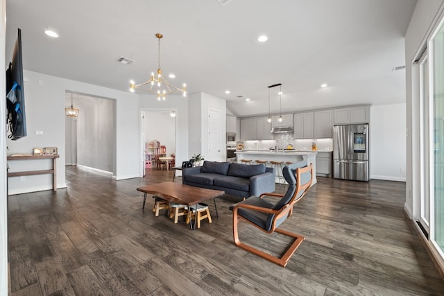 513 Elworth Path, Lakeway, TX 78738 - living room featuring dark wood-type flooring, a chandelier, baseboards, and recessed lighting