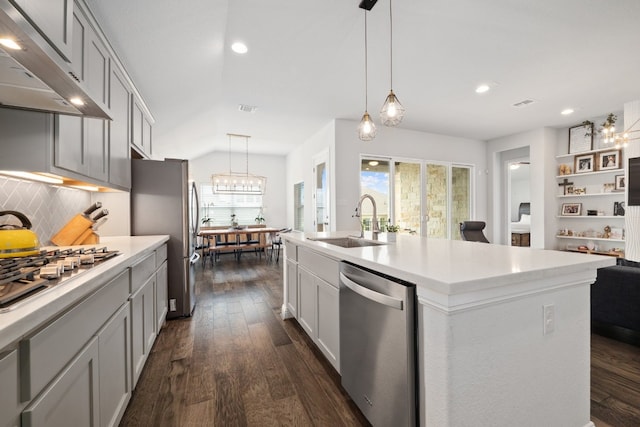 kitchen featuring sink, ventilation hood, a center island with sink, appliances with stainless steel finishes, and pendant lighting