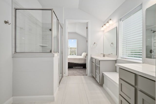 bathroom with vaulted ceiling, vanity, and walk in shower