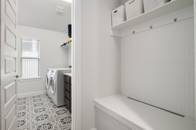 513 Elworth Path, Lakeway, TX 78738 - washroom with washing machine and clothes dryer and baseboards