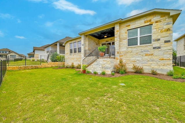 513 Elworth Path, Lakeway, TX 78738 - rear view of property with stone siding, a ceiling fan, and stairway