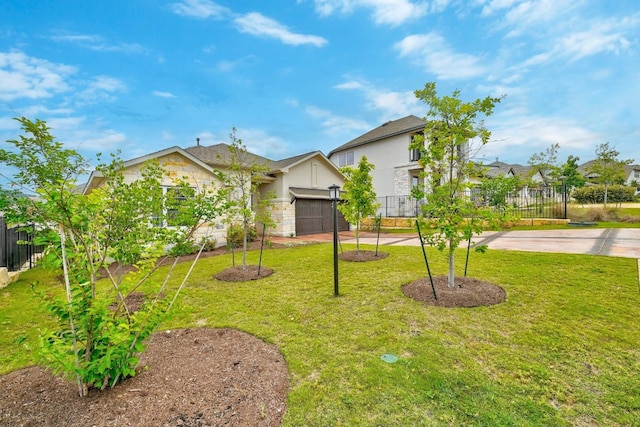 view of front of house featuring a garage and a front yard