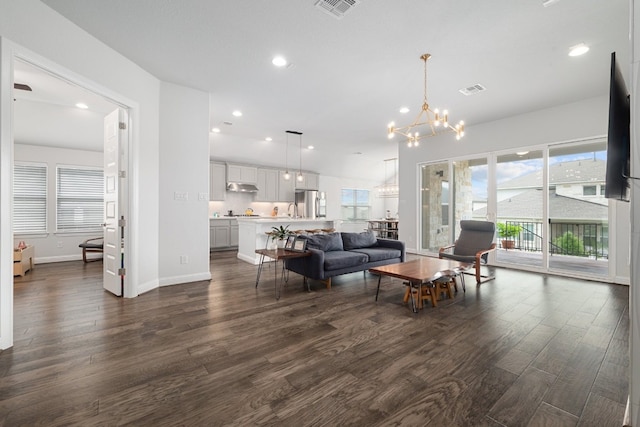 513 Elworth Path, Lakeway, TX 78738 - living room featuring a chandelier, dark wood-style floors, recessed lighting, and baseboards