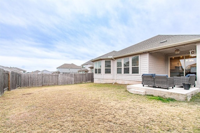 rear view of house featuring an outdoor living space, a yard, and a patio area