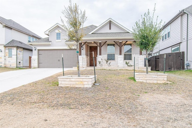 view of front of home with a garage and covered porch