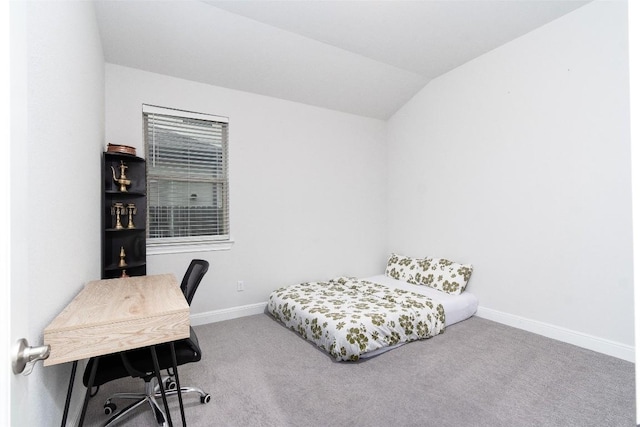 carpeted bedroom with vaulted ceiling