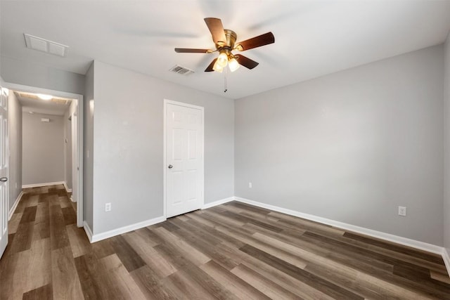 unfurnished bedroom with dark hardwood / wood-style floors and ceiling fan