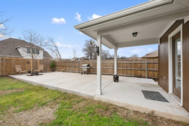 view of patio with grilling area and an outdoor fire pit