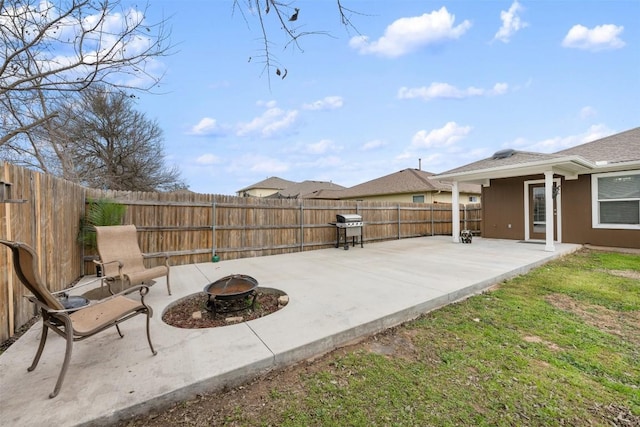 view of patio with grilling area and an outdoor fire pit