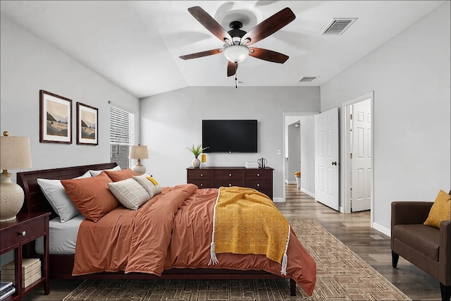 bedroom featuring dark wood-type flooring, ceiling fan, and vaulted ceiling