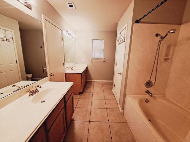 full bathroom with bathtub / shower combination, vanity, toilet, and tile patterned flooring