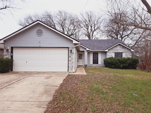 ranch-style house with a garage and a front yard