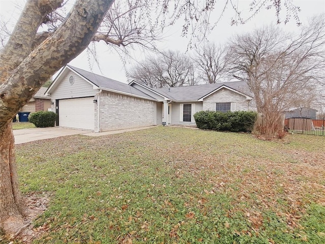 ranch-style home with a garage and a front lawn