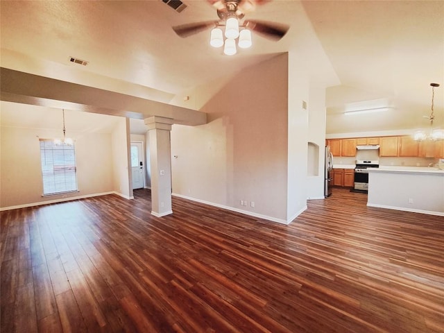 unfurnished living room featuring dark hardwood / wood-style flooring, ceiling fan with notable chandelier, and high vaulted ceiling