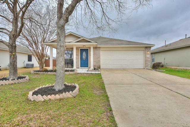 view of front facade with a garage, central AC, and a front yard