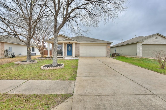 2718 Summerwalk Pl, Round Rock, TX 78665 - ranch-style home with a front lawn, brick siding, driveway, and an attached garage