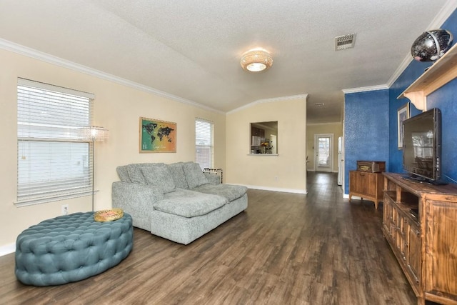2718 Summerwalk Pl, Round Rock, TX 78665 - living room featuring crown molding, dark wood-type flooring, and a textured ceiling