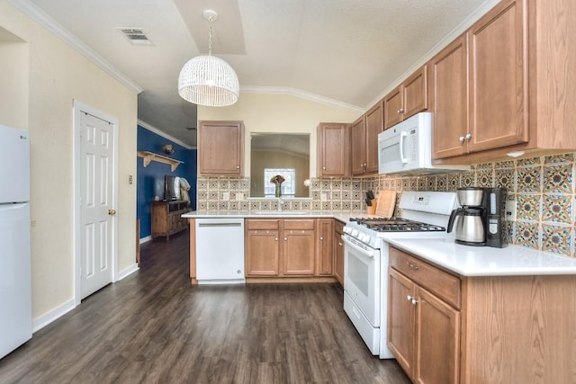 2718 Summerwalk Pl, Round Rock, TX 78665 - kitchen with white appliances, vaulted ceiling, backsplash, light countertops, and crown molding