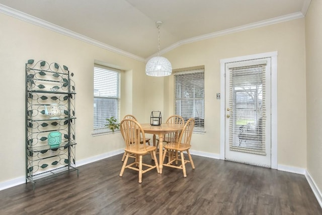 dining area with dark wood-type flooring, ornamental molding, and vaulted ceiling