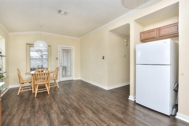 2718 Summerwalk Pl, Round Rock, TX 78665 - dining space featuring dark wood-type flooring, crown molding, and lofted ceiling