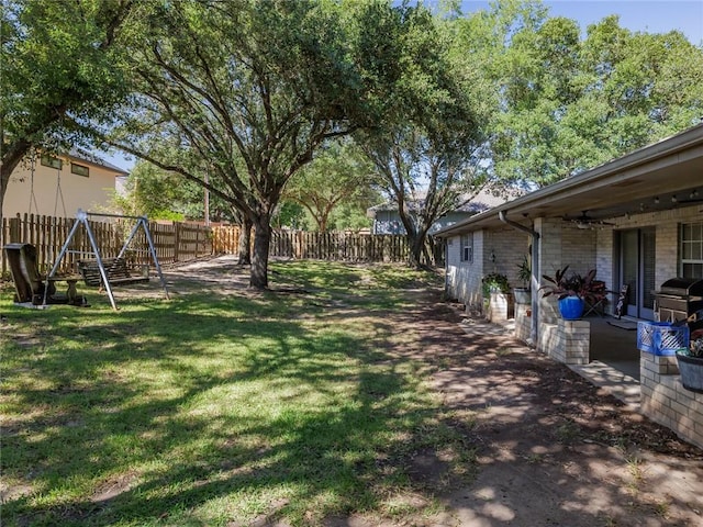 view of yard with a playground and a patio