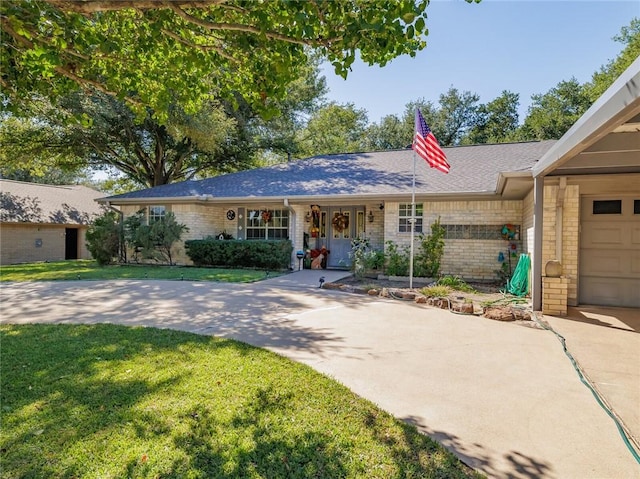 ranch-style house with a garage, a front yard, and a porch