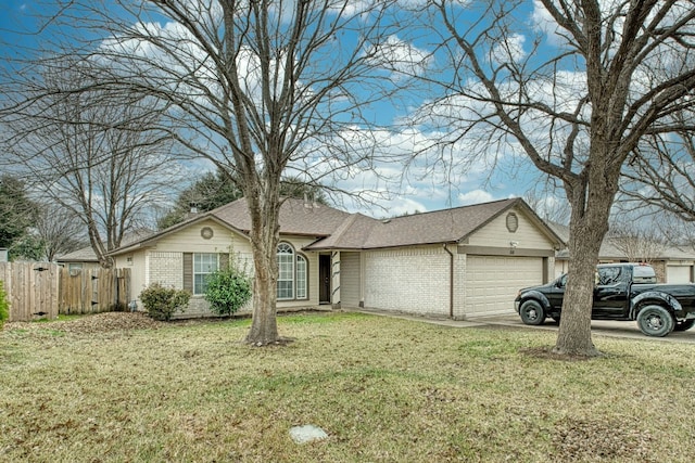 single story home with a front yard and a garage