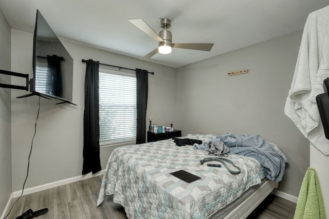 bedroom featuring hardwood / wood-style flooring and ceiling fan