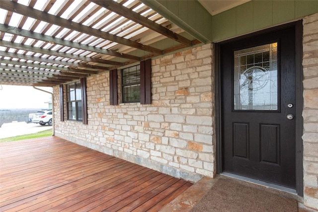 property entrance featuring a pergola