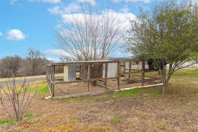 exterior space featuring a rural view and an outdoor structure