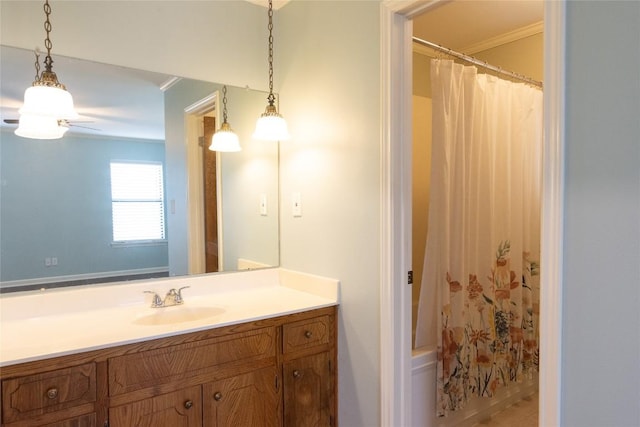 bathroom with vanity, shower / tub combo, and ornamental molding