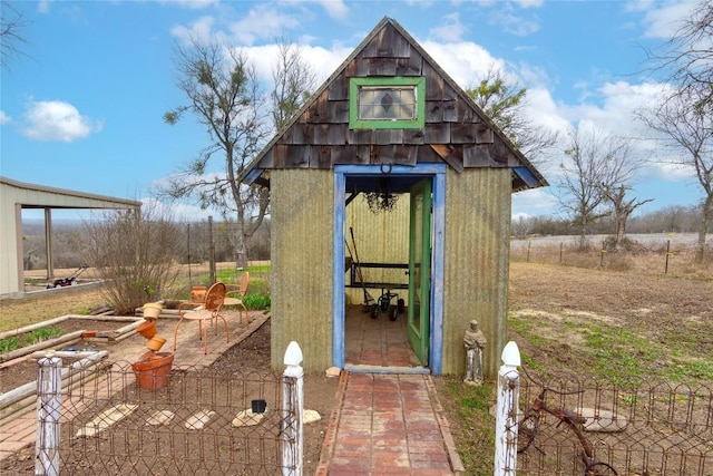 view of outbuilding featuring a rural view