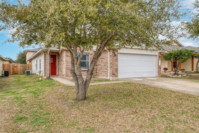 view of front of property with a garage, a front yard, and cooling unit