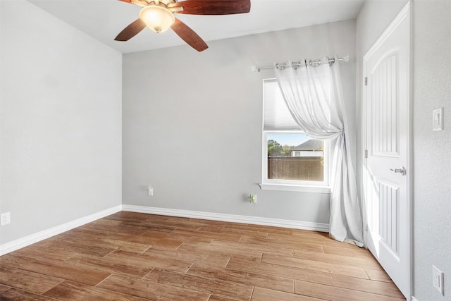 empty room with light hardwood / wood-style flooring and ceiling fan