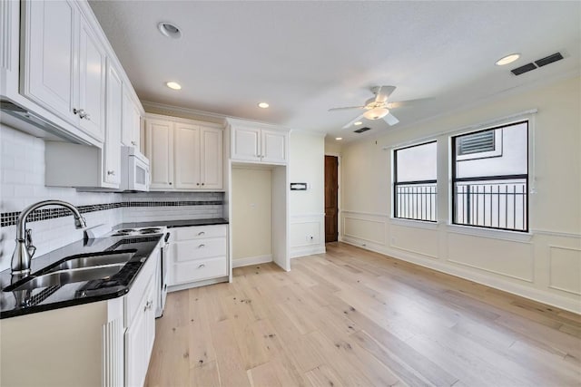 3701 Copper Ridge Ct, Austin, TX 78734 - kitchen featuring white microwave, a ceiling fan, white cabinetry, light wood-type flooring, and recessed lighting