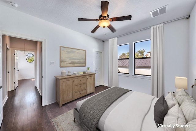 3701 Copper Ridge Ct, Austin, TX 78734 - bedroom featuring dark wood finished floors, baseboards, and a ceiling fan