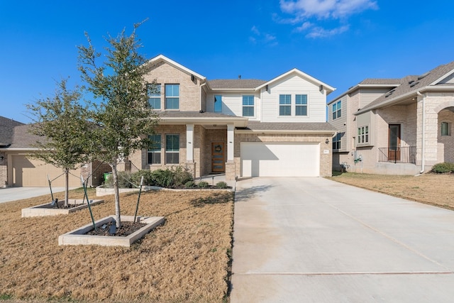 view of front of house featuring a garage and a front lawn