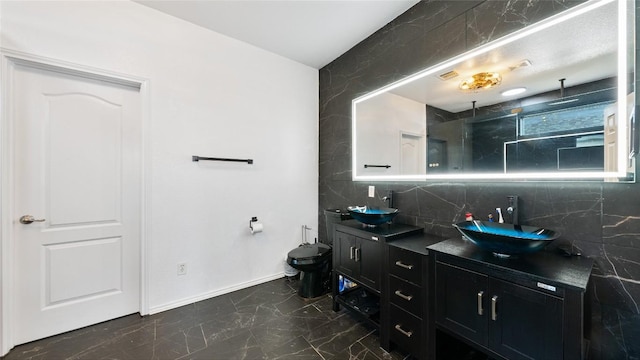 bathroom featuring vanity, a shower, backsplash, and toilet