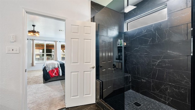 bathroom featuring a tile shower