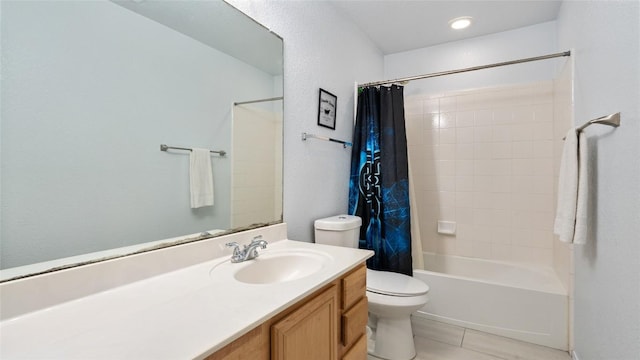 full bathroom featuring tile patterned floors, toilet, shower / bath combo with shower curtain, and vanity