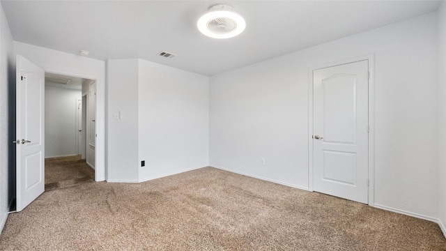 empty room featuring carpet floors