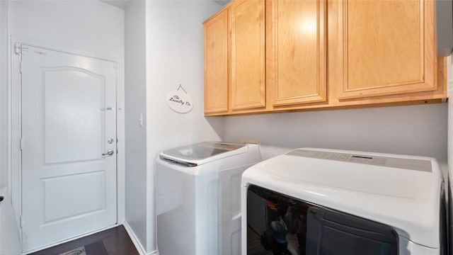 laundry room with cabinets and washing machine and dryer