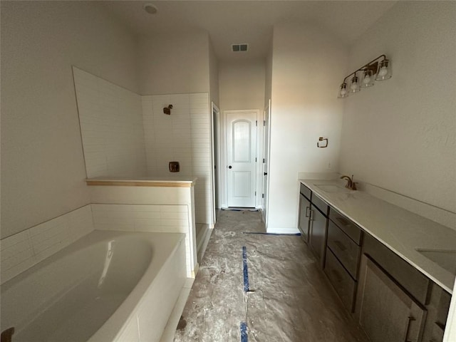 bathroom featuring visible vents, a tile shower, a bath, and vanity