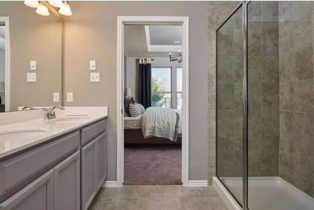 bathroom featuring walk in shower, vanity, tile patterned flooring, and a notable chandelier