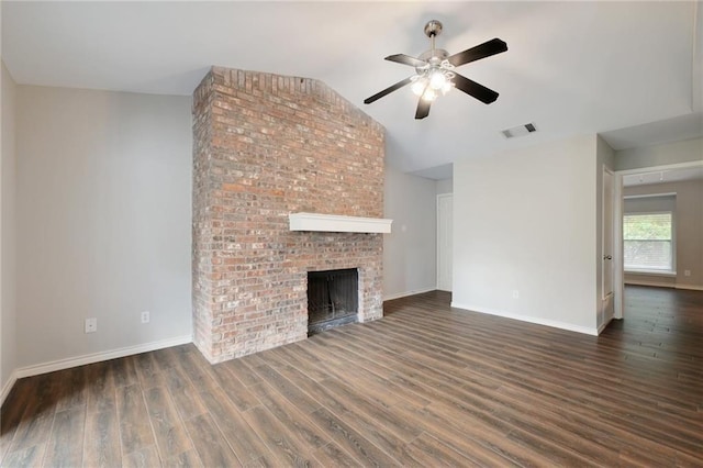 unfurnished living room featuring dark hardwood / wood-style flooring, a fireplace, ceiling fan, and vaulted ceiling